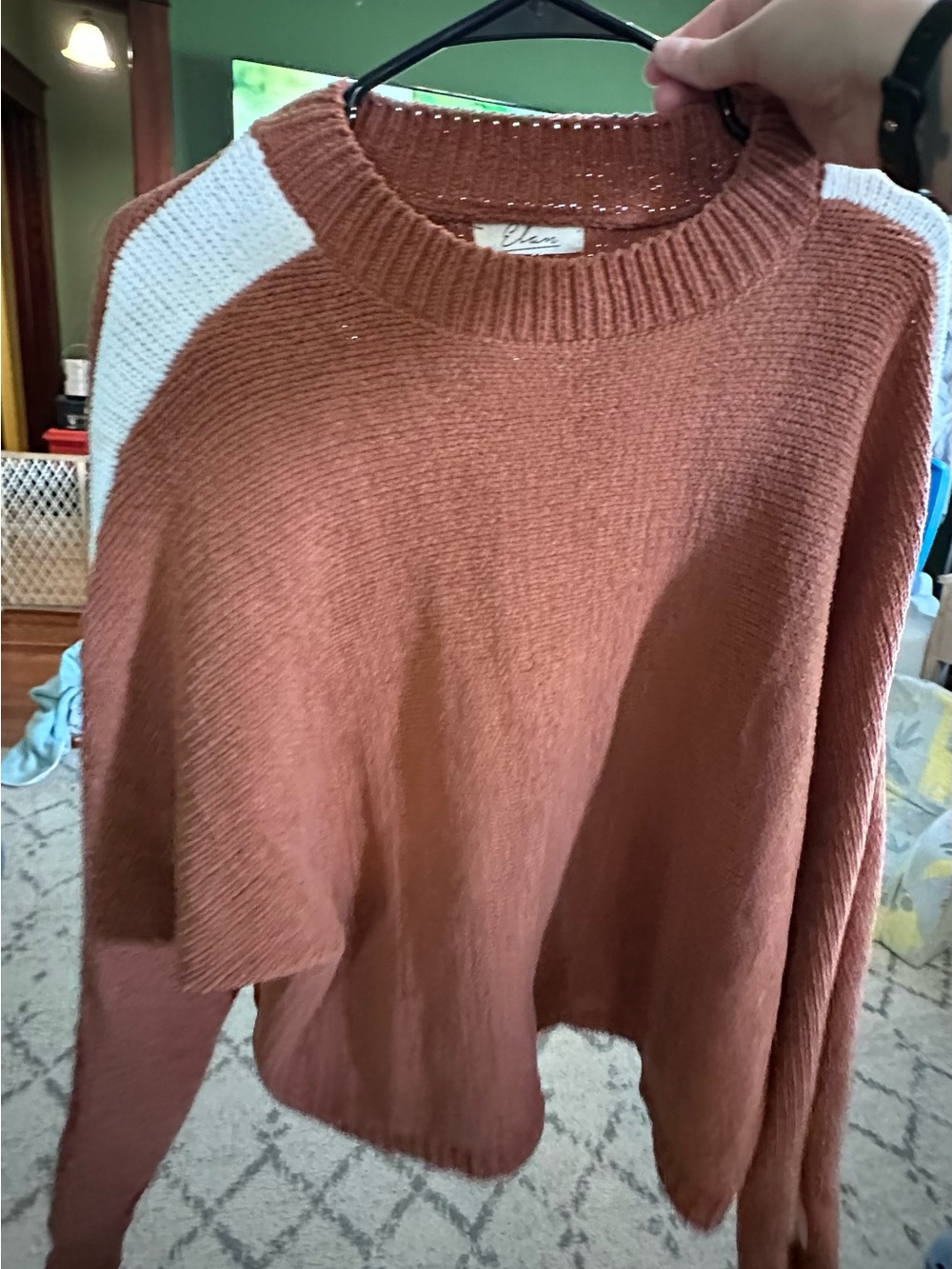 Cozy Rust Crewneck Sweater with White Shoulder Accent